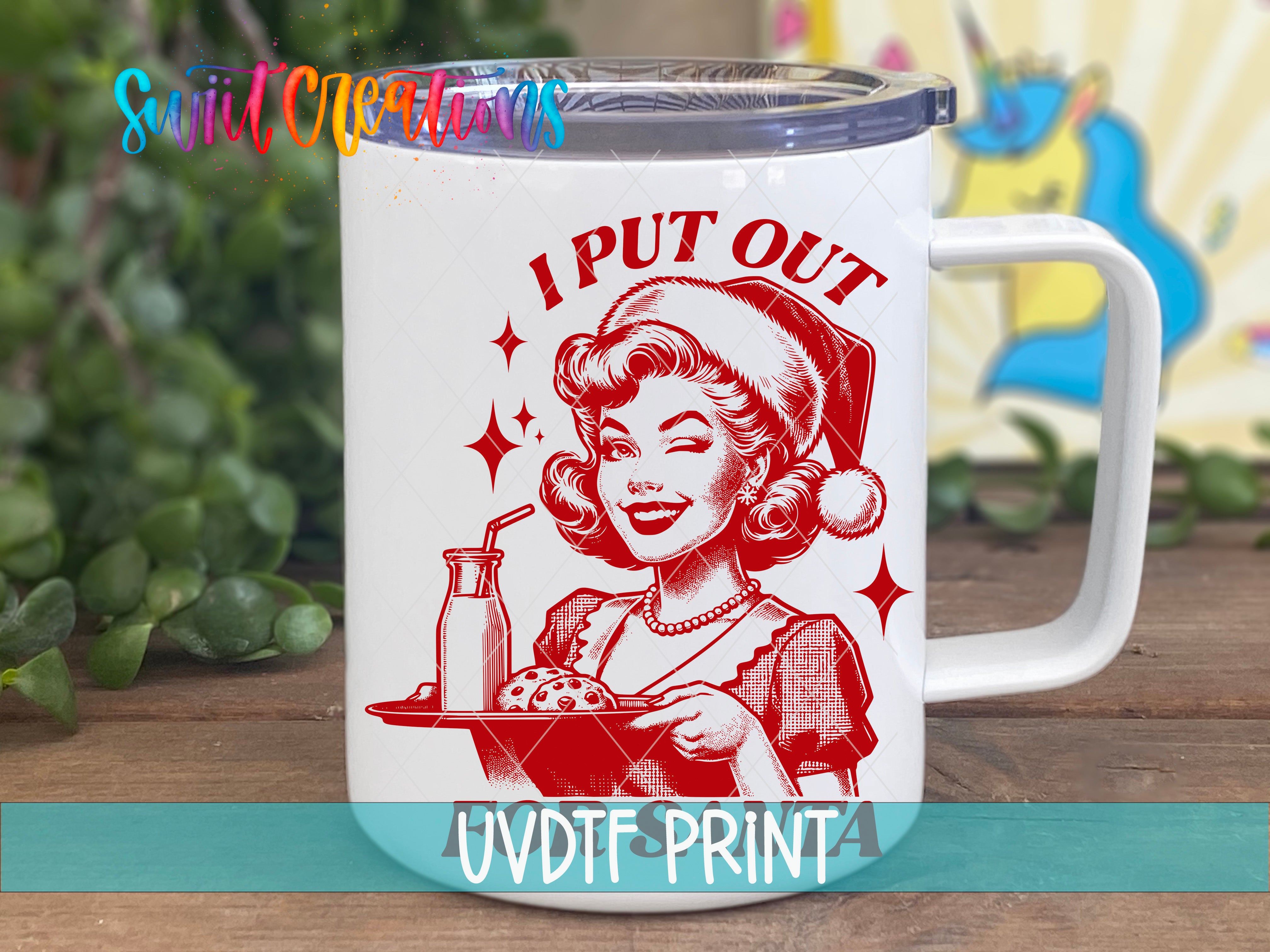 A white mug with a red illustration of a smiling woman wearing a Santa hat and holding a tray of food, along with the text "I PUT OUT" and "UVDFRINTA".