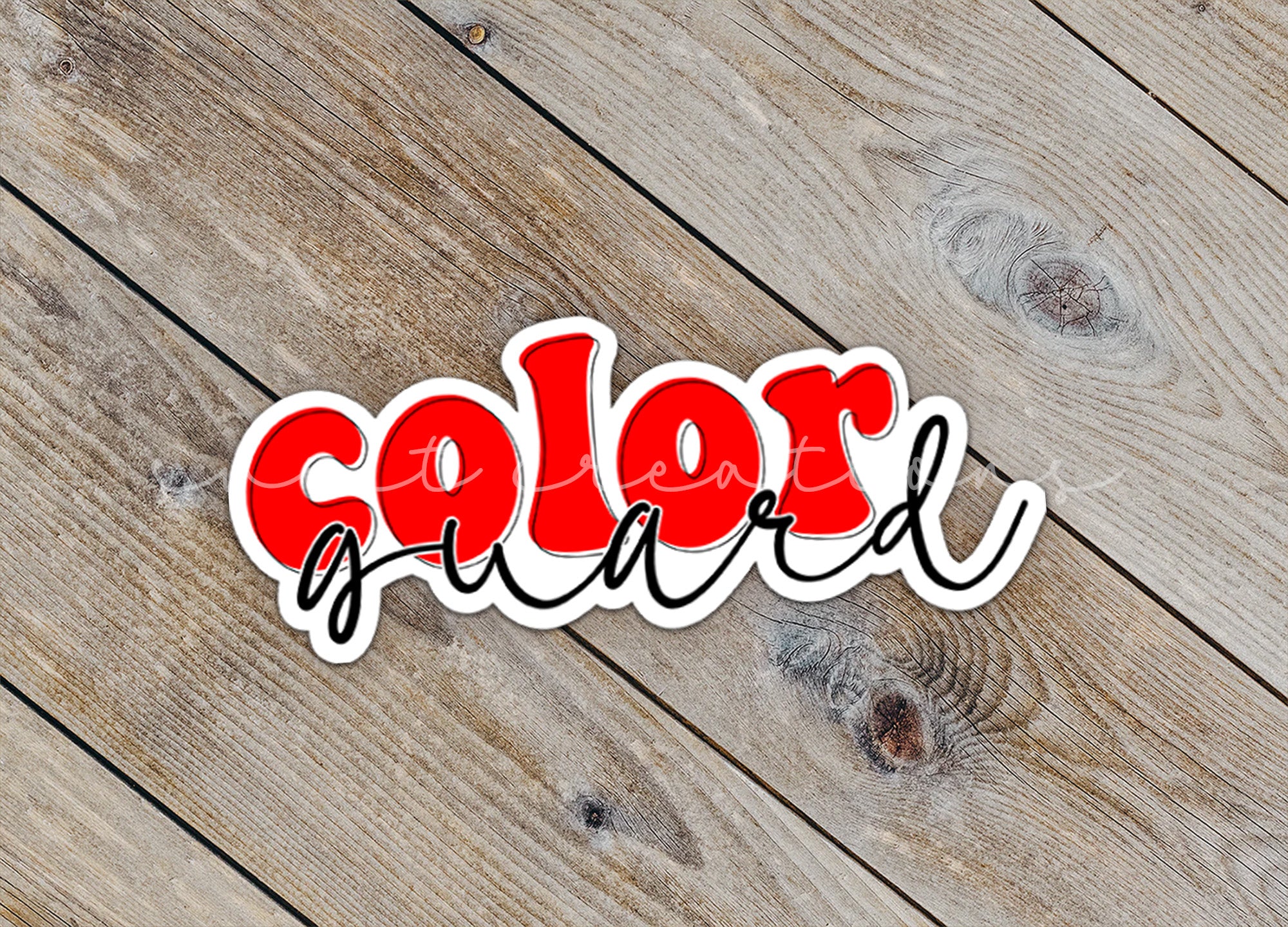 a sticker that says color is on a wooden surface