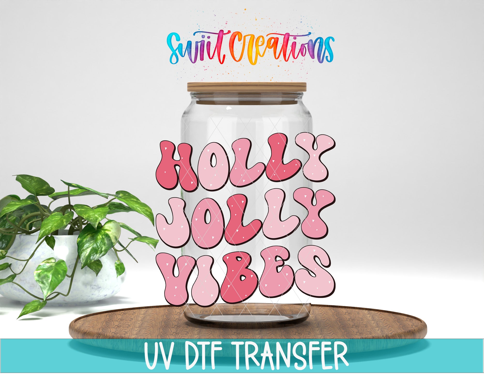 a glass jar with the words "Holly Jolly Vibes" written on it, along with a plant and a wooden tray in the background.