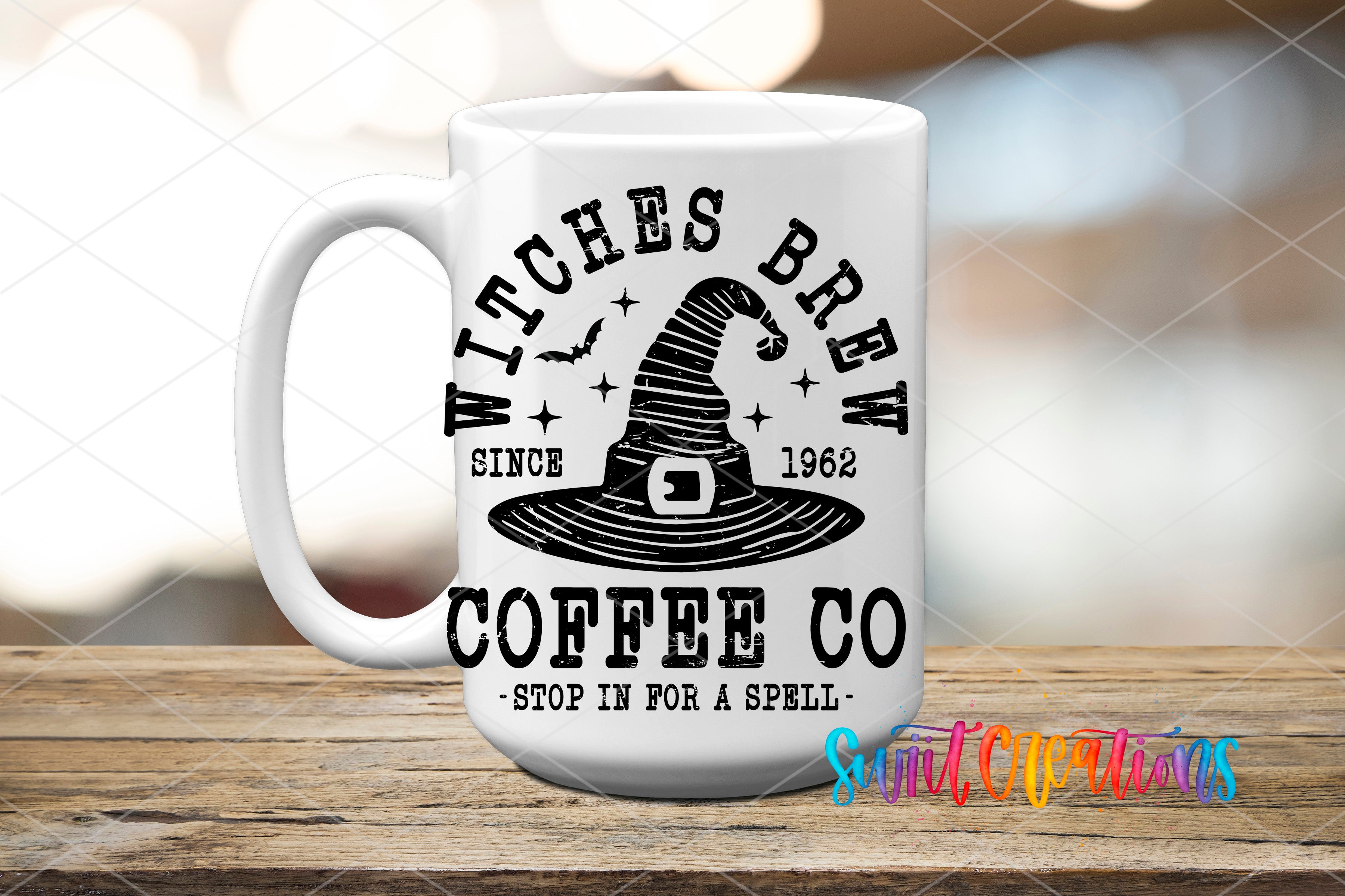 A white coffee mug with a black and white graphic design featuring a witch's hat and the text "WITCHES BREW CO" printed on it.
