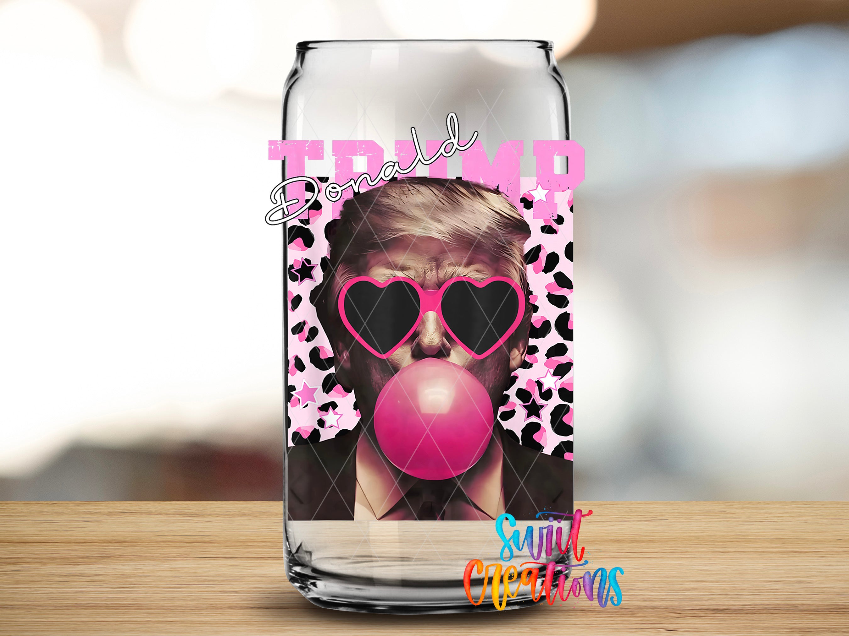 A can with a graphic design featuring a man wearing sunglasses and a bubblegum bubble blowing.