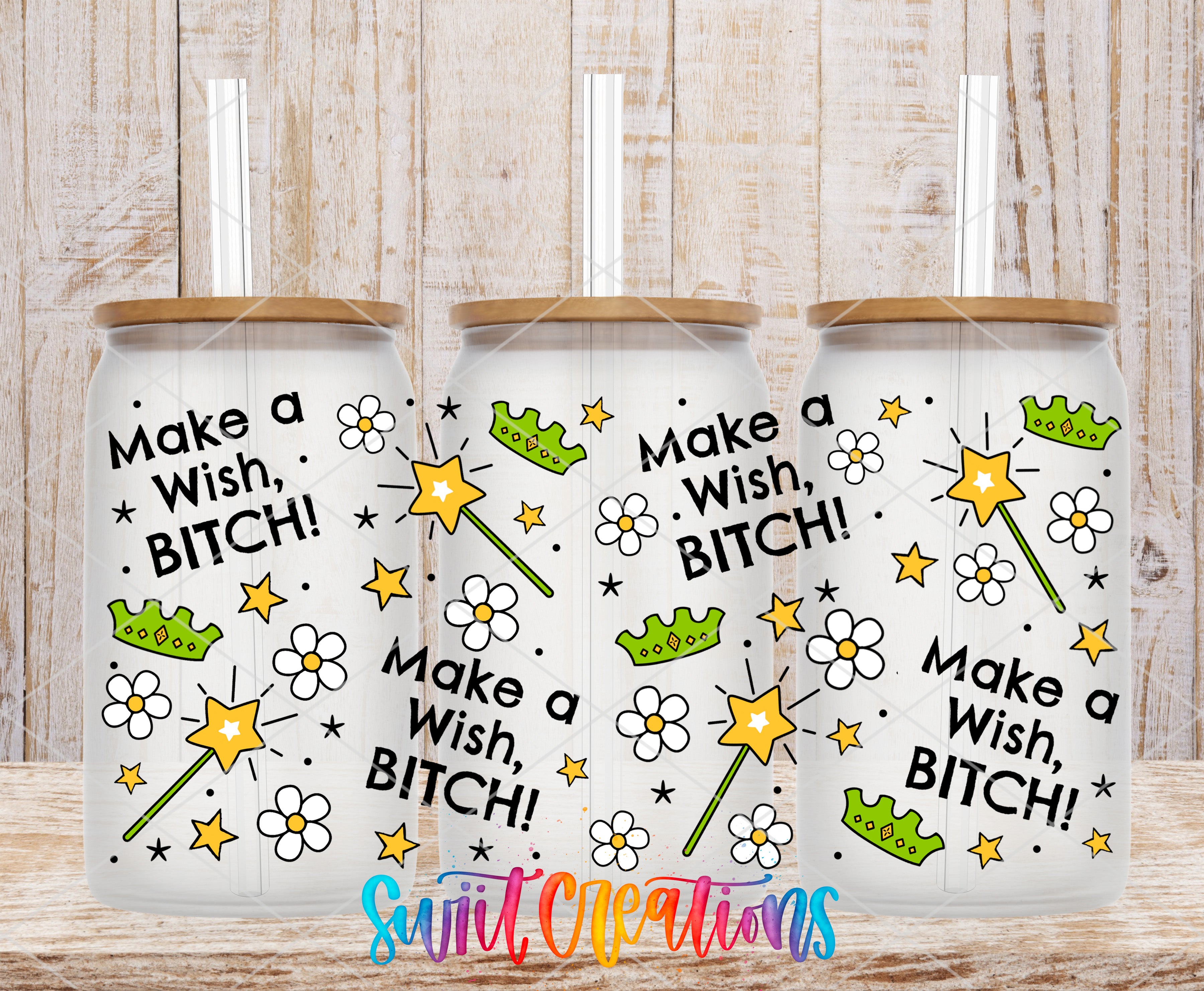 Three white tumblers with black text and illustrations, including stars, flowers, and crowns, against a wooden background.