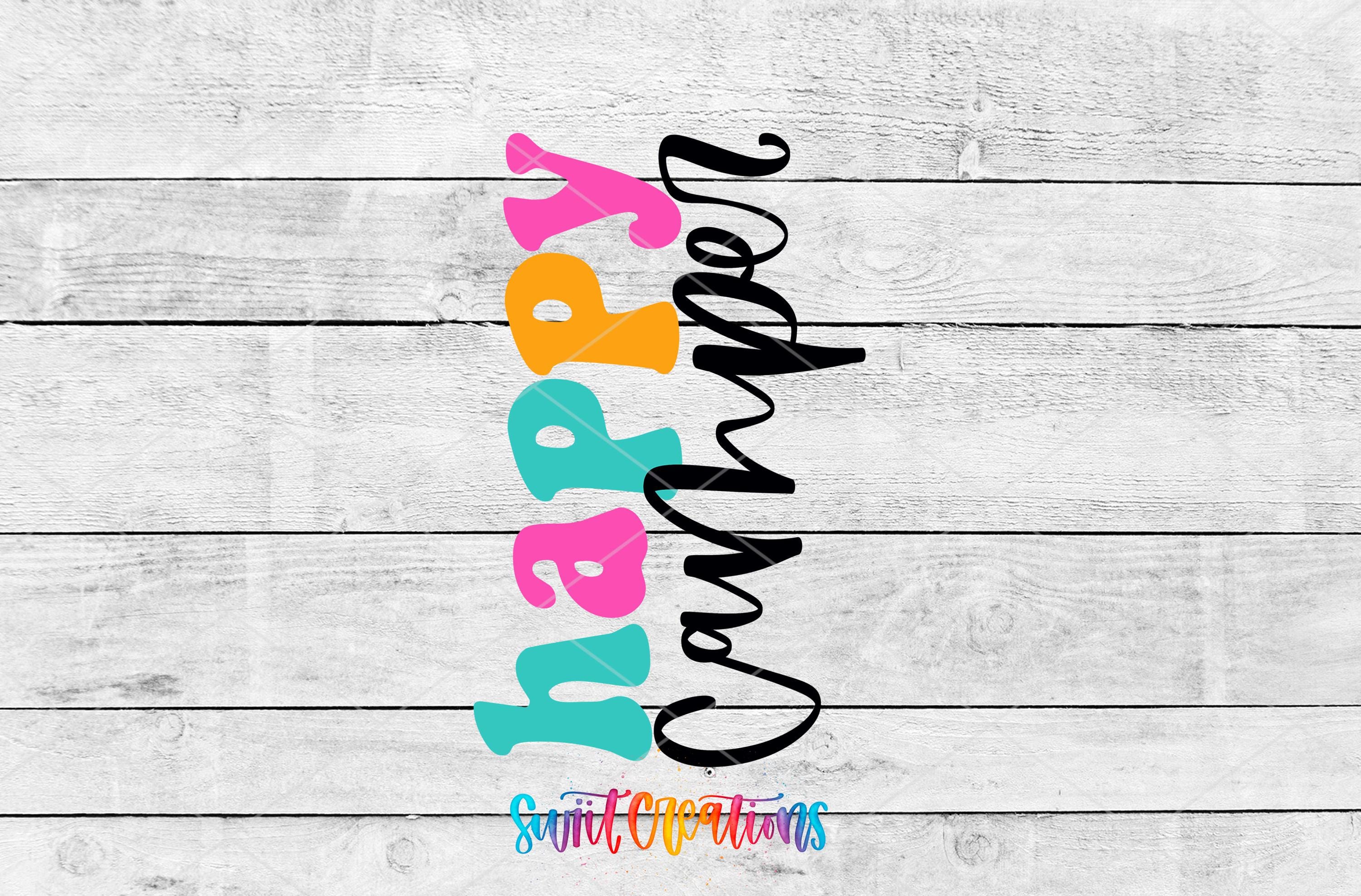 a colorful, stylized text that reads "Happy Camper" against a white wooden background.