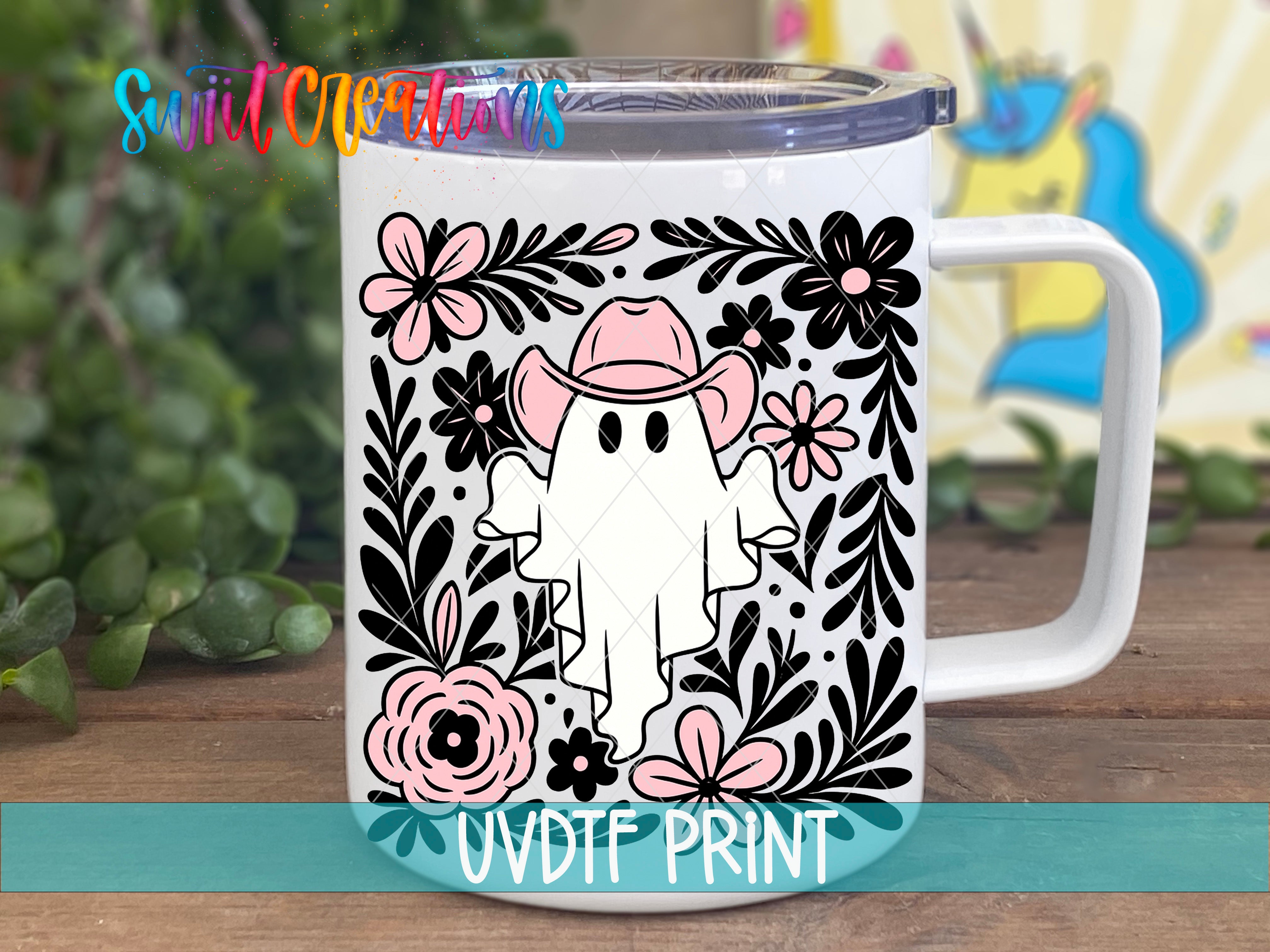 A white mug with a whimsical design featuring a ghost wearing a cowboy hat surrounded by flowers and leaves.