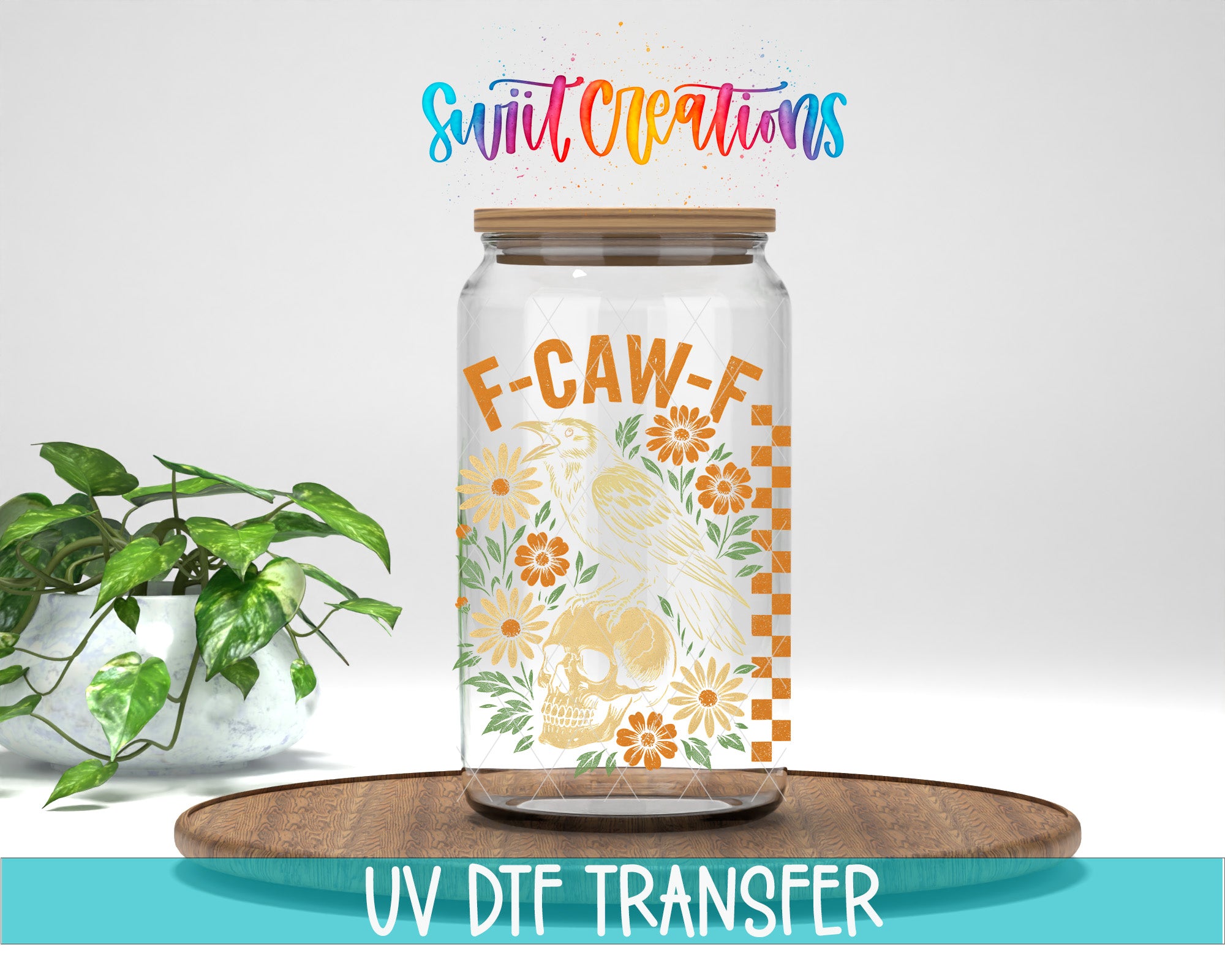 a glass jar with a label that includes a skull and flowers, placed on a wooden surface. The jar is surrounded by a potted plant, and there is text at the bottom of the image that says "UV DFT TRANSFER".