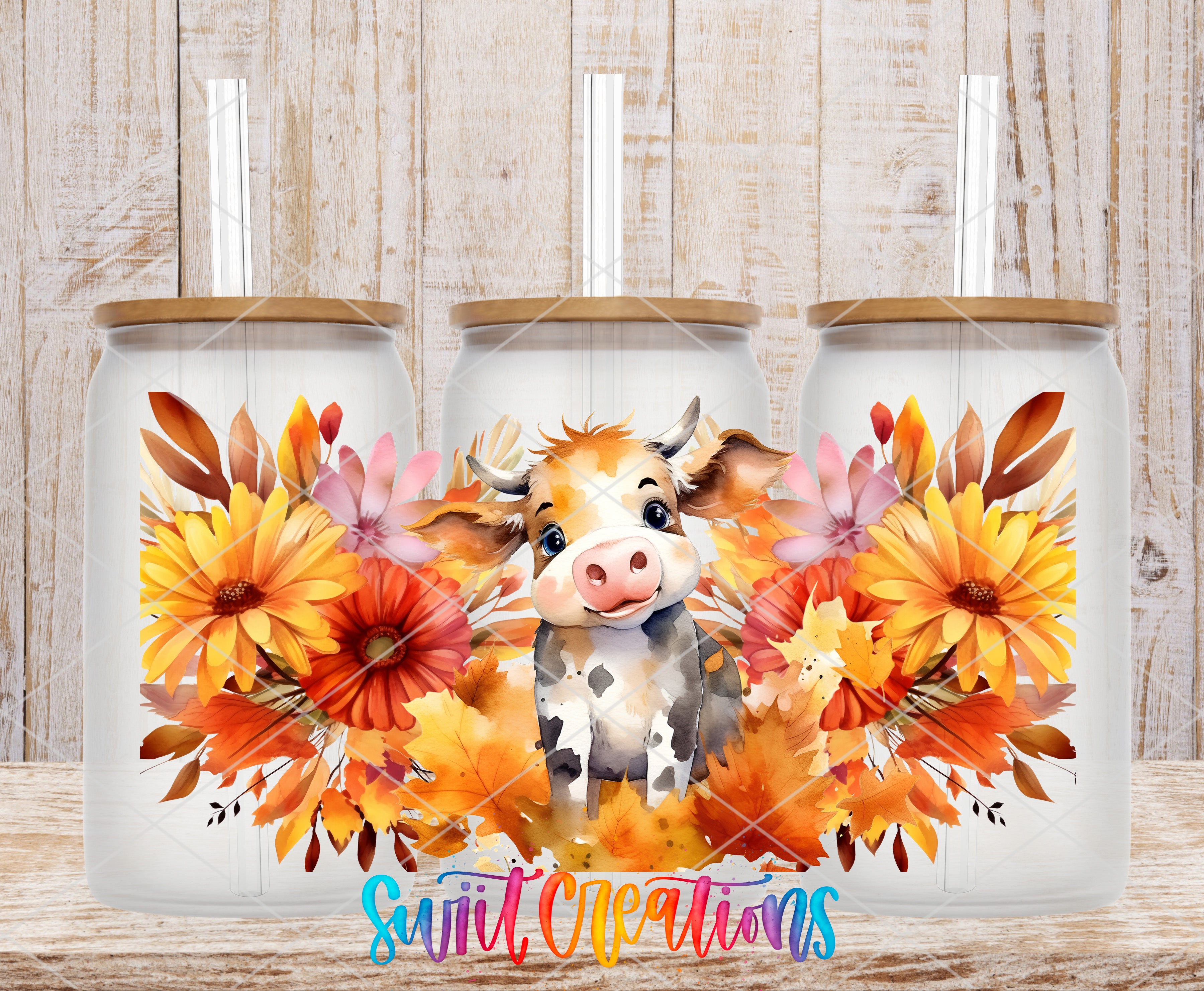 A collage of three glass jars with a cow design and autumn flowers on a wooden background.