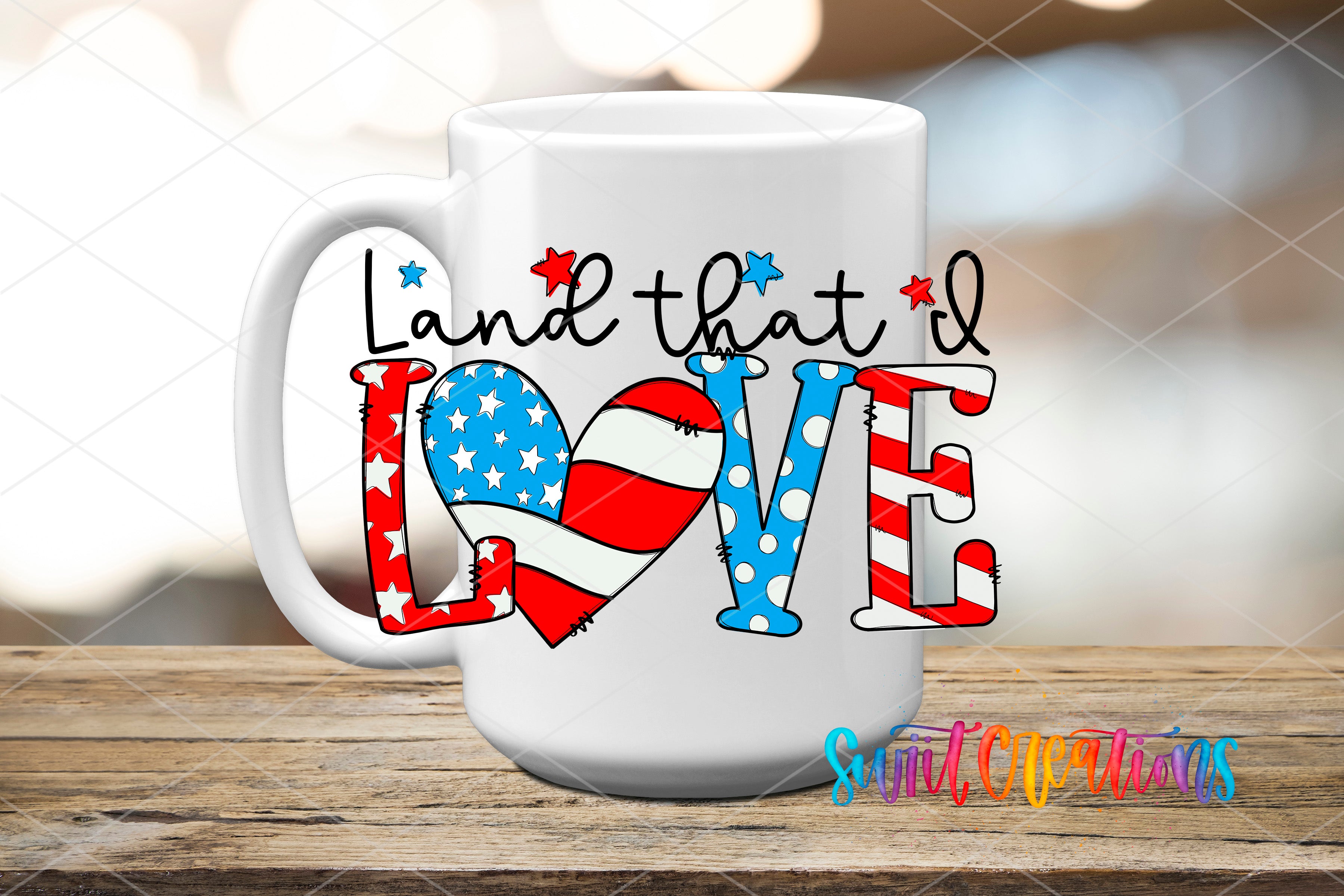 A white mug with the text "Land that I Love" printed on it, along with an American flag design.
