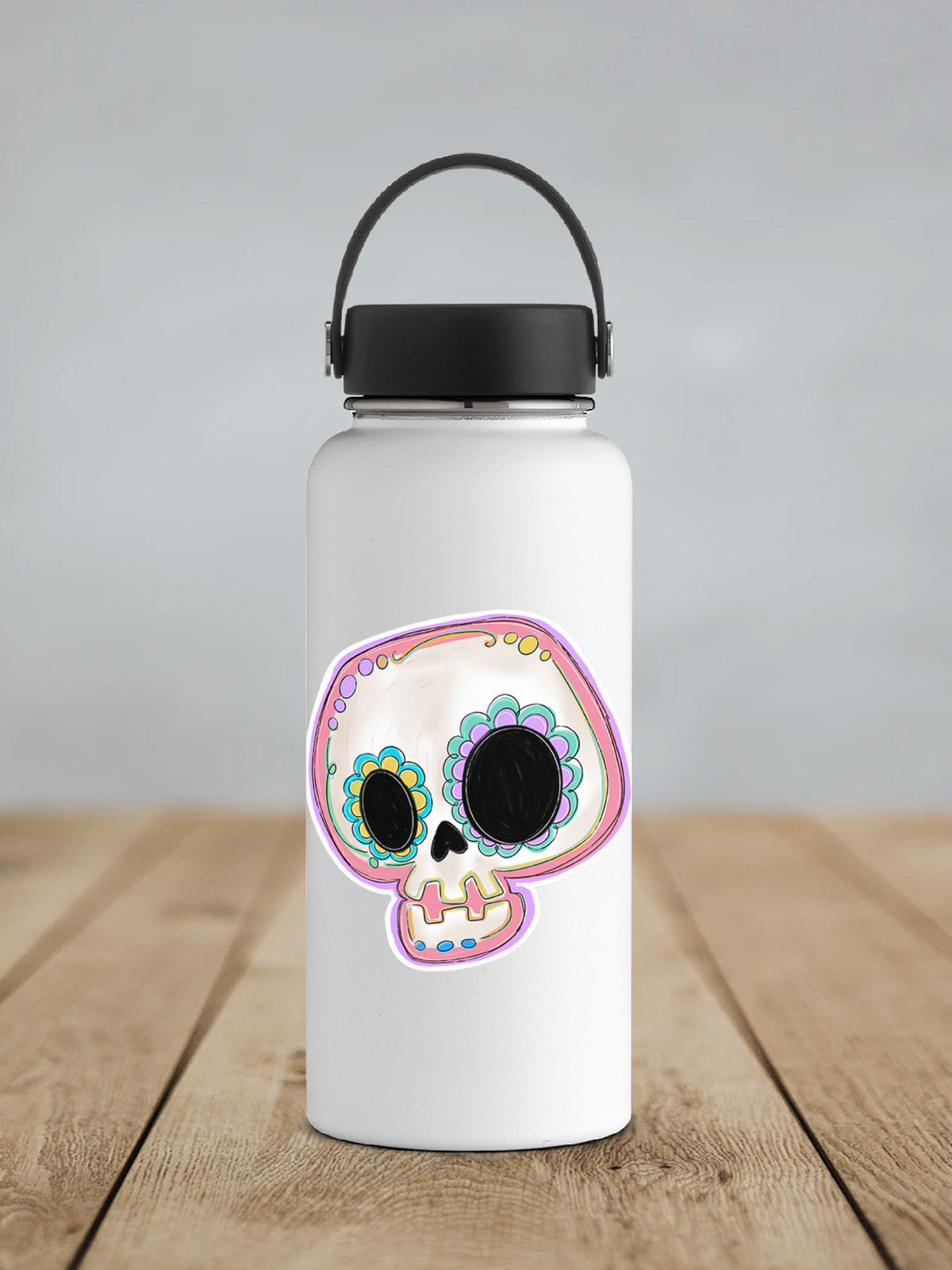 a water bottle with a picture of a skull on it
