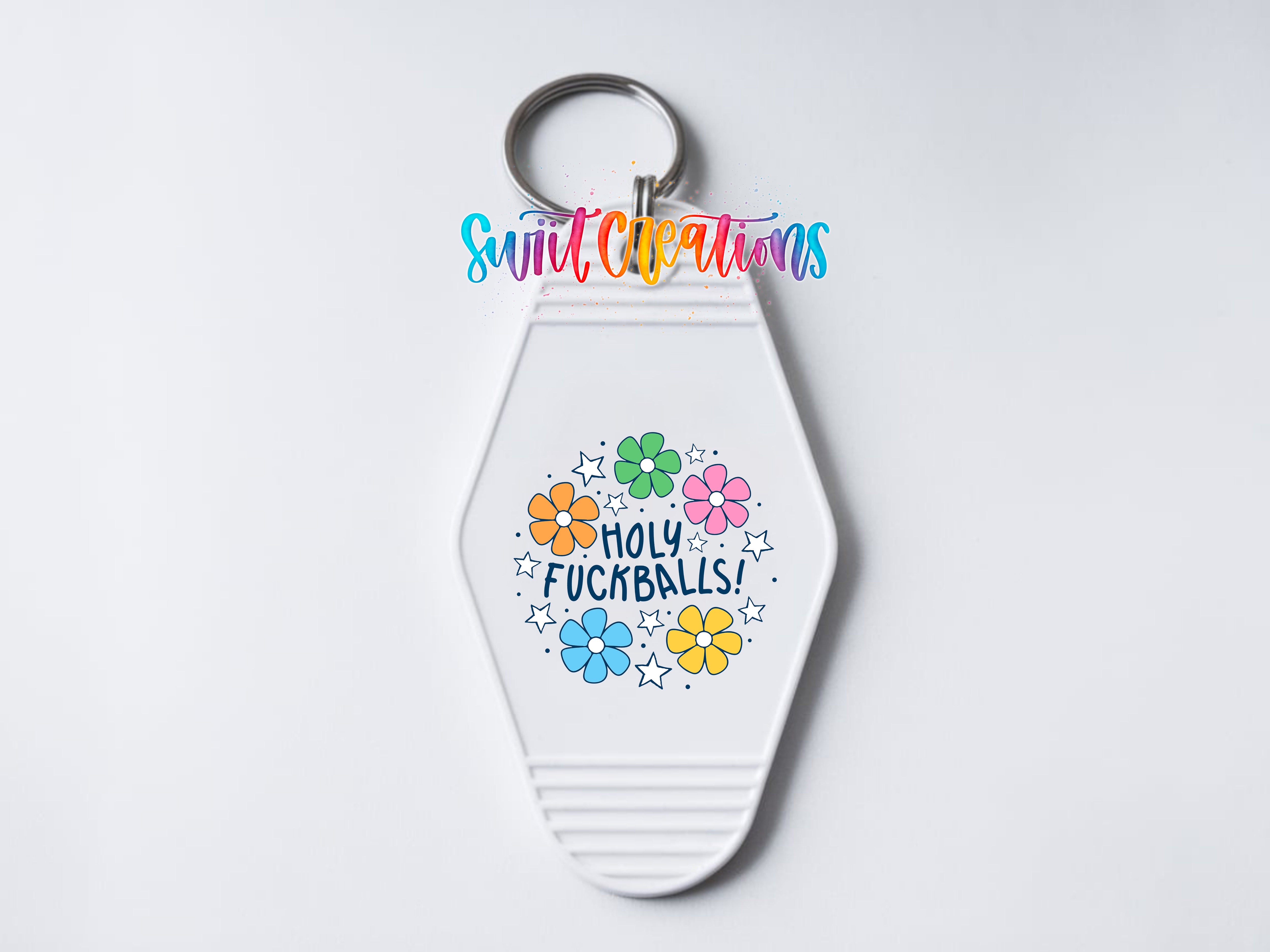 A keychain with a colorful design and text on it.
