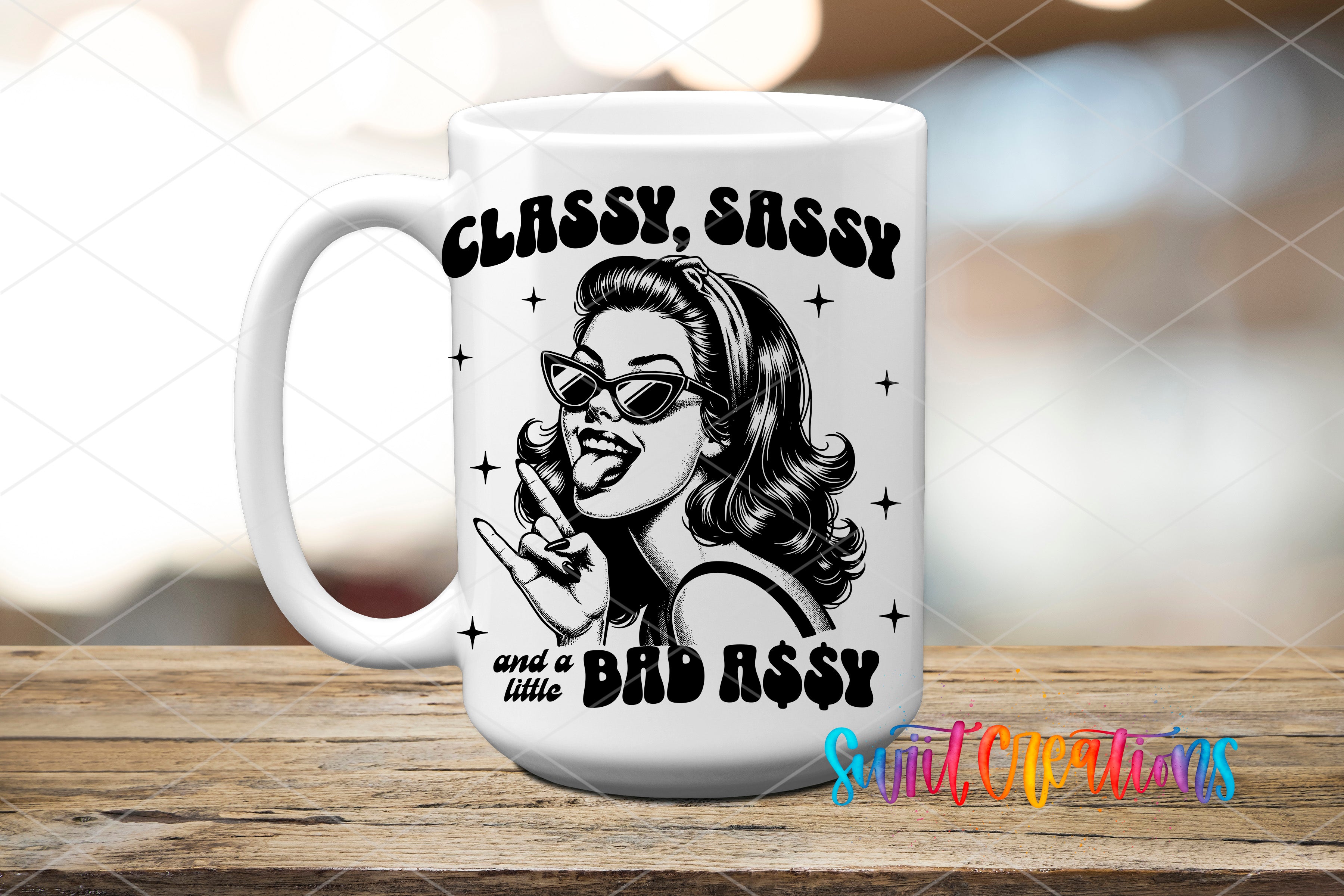 A white ceramic mug with a black and white illustration of a woman with sunglasses and a playful expression, along with the text "CLASSY, SASSY and a little BAD ASSY" printed on it.