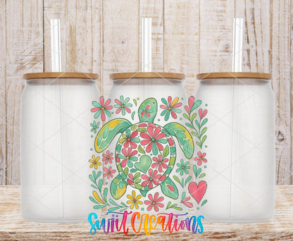 Floral Sea Turtle UV DTF transfer applied to a clear glass can set from Swiit Creations