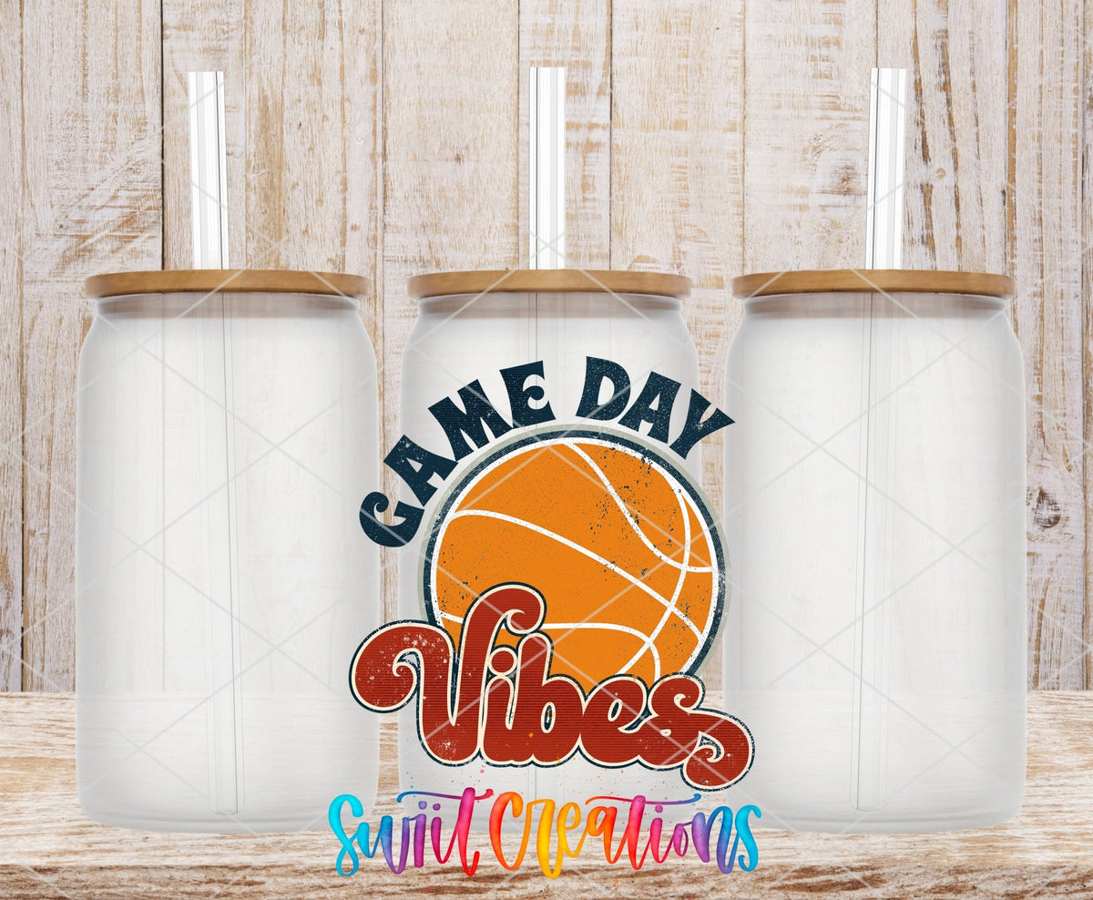 Three clear glass cans with the Game Day Vibes Basketball UV DTF transfer by Swiit Creations
