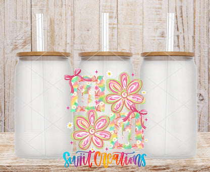 Gigi Tie Dye Flowers UV DTF transfer applied to a clear glass can set from Swiit Creations
