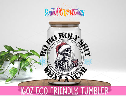 Ho Ho Holy Shit What a Year design on a 16 oz clear glass tumbler with bamboo lid
