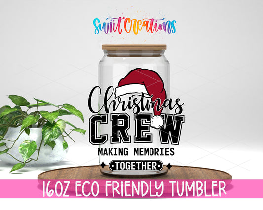 Christmas Crew design on a 16 oz clear glass tumbler with bamboo lid