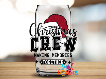 Christmas Crew design close-up on a clear glass can tumbler
