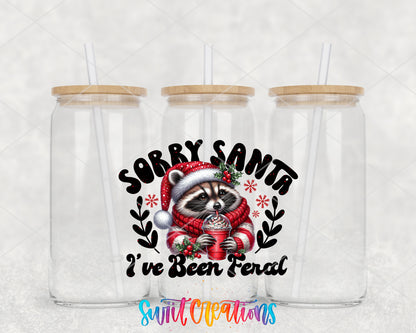 Sorry Santa I Have Been Feral Raccoon clear glass tumbler group mockup with bamboo lids and straws