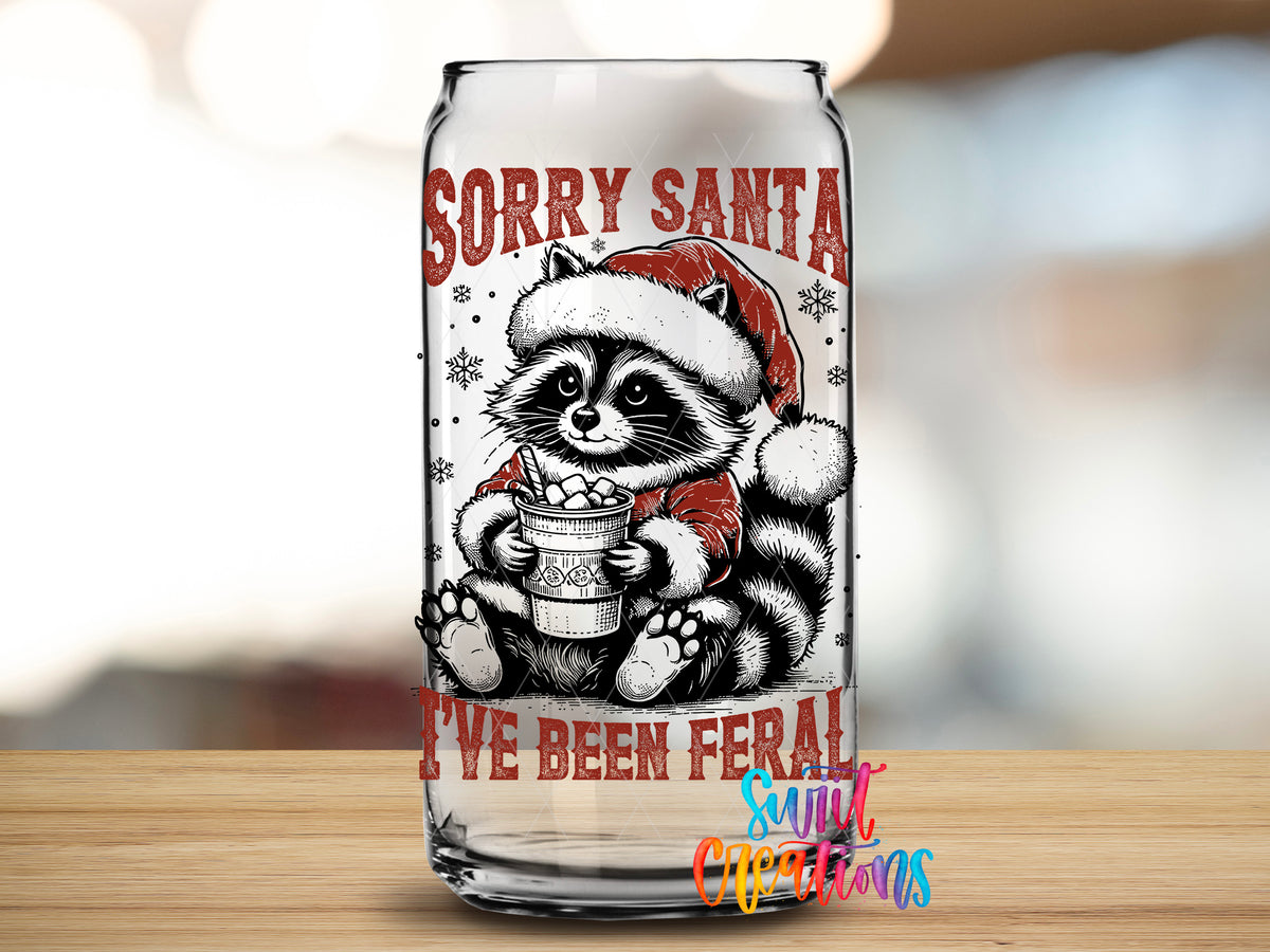 Sorry Santa Feral Raccoon design close-up on a clear glass can tumbler