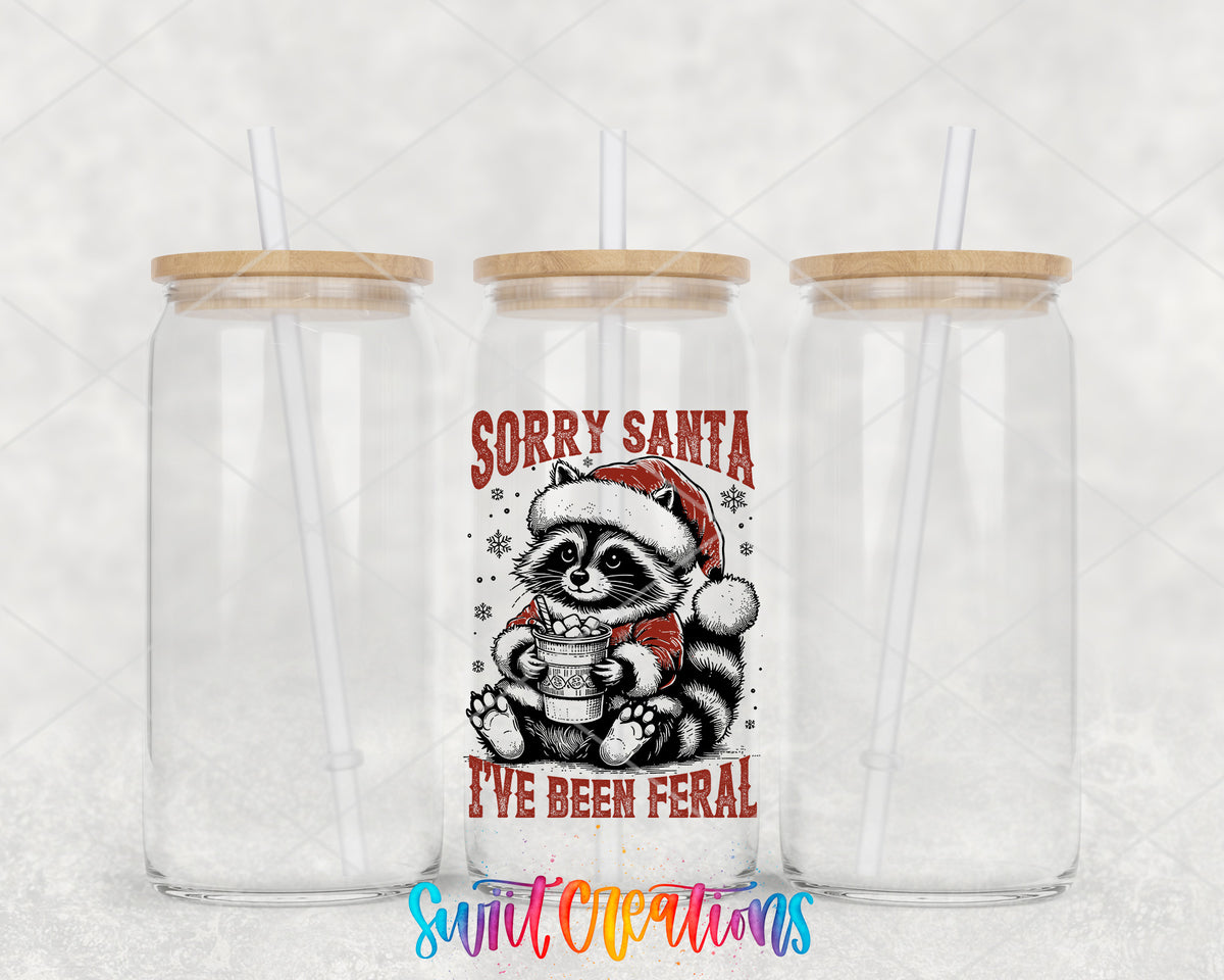 Sorry Santa Feral Raccoon clear glass tumbler group mockup with bamboo lids and straws