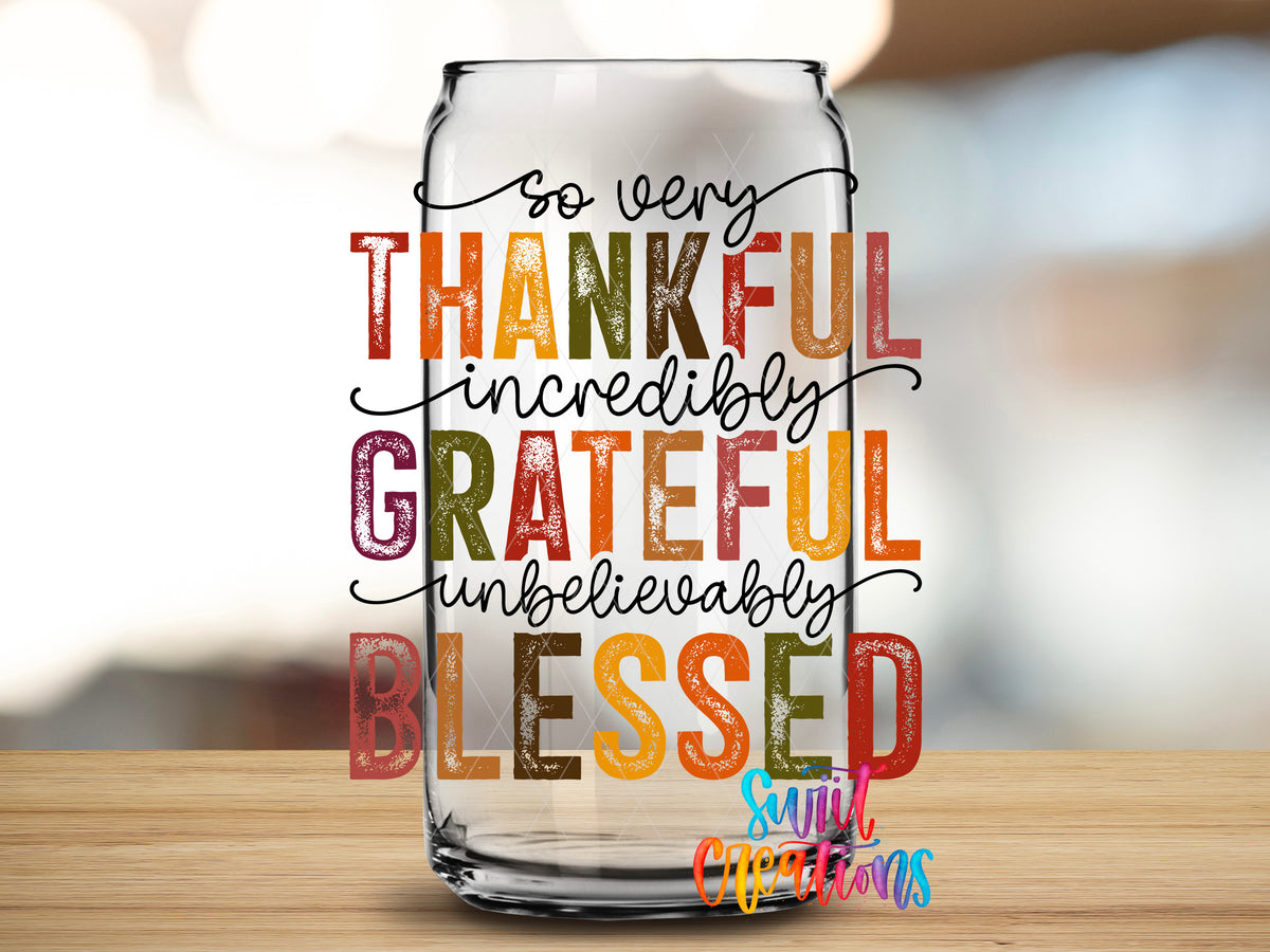 Thankful Grateful Blessed design close-up on a clear glass can tumbler