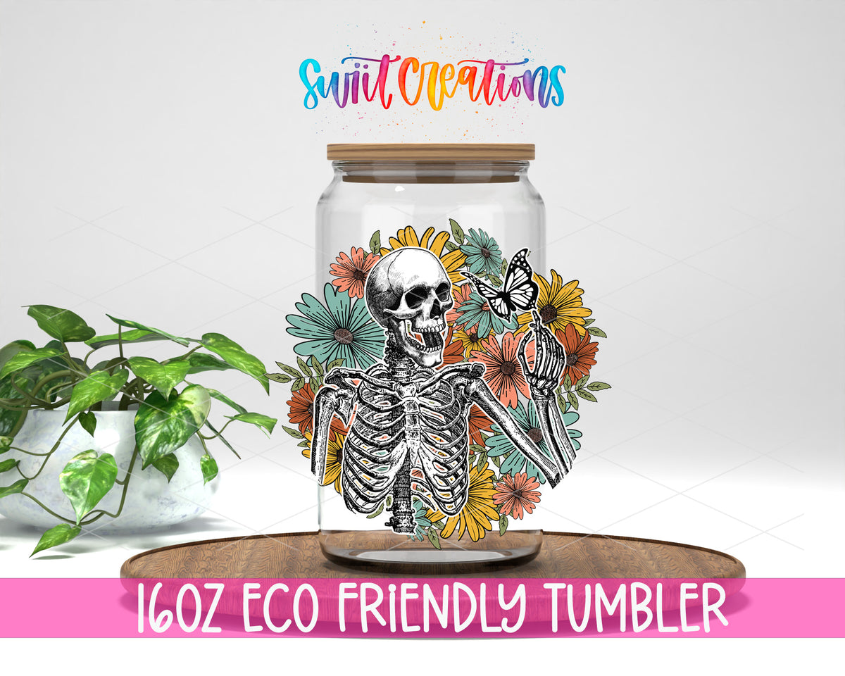 Retro Floral Skeleton design on a 16 oz clear glass tumbler with bamboo lid