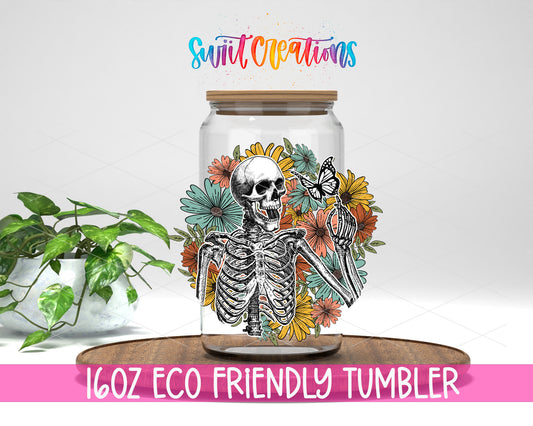 Retro Floral Skeleton design on a 16 oz clear glass tumbler with bamboo lid