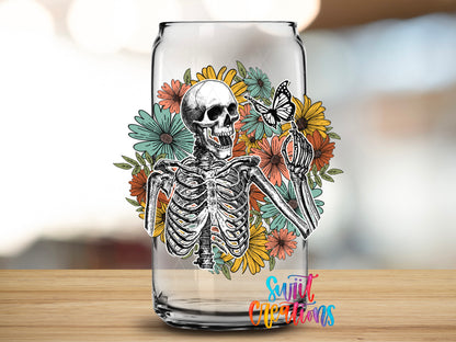 Retro Floral Skeleton design close-up on a clear glass can tumbler