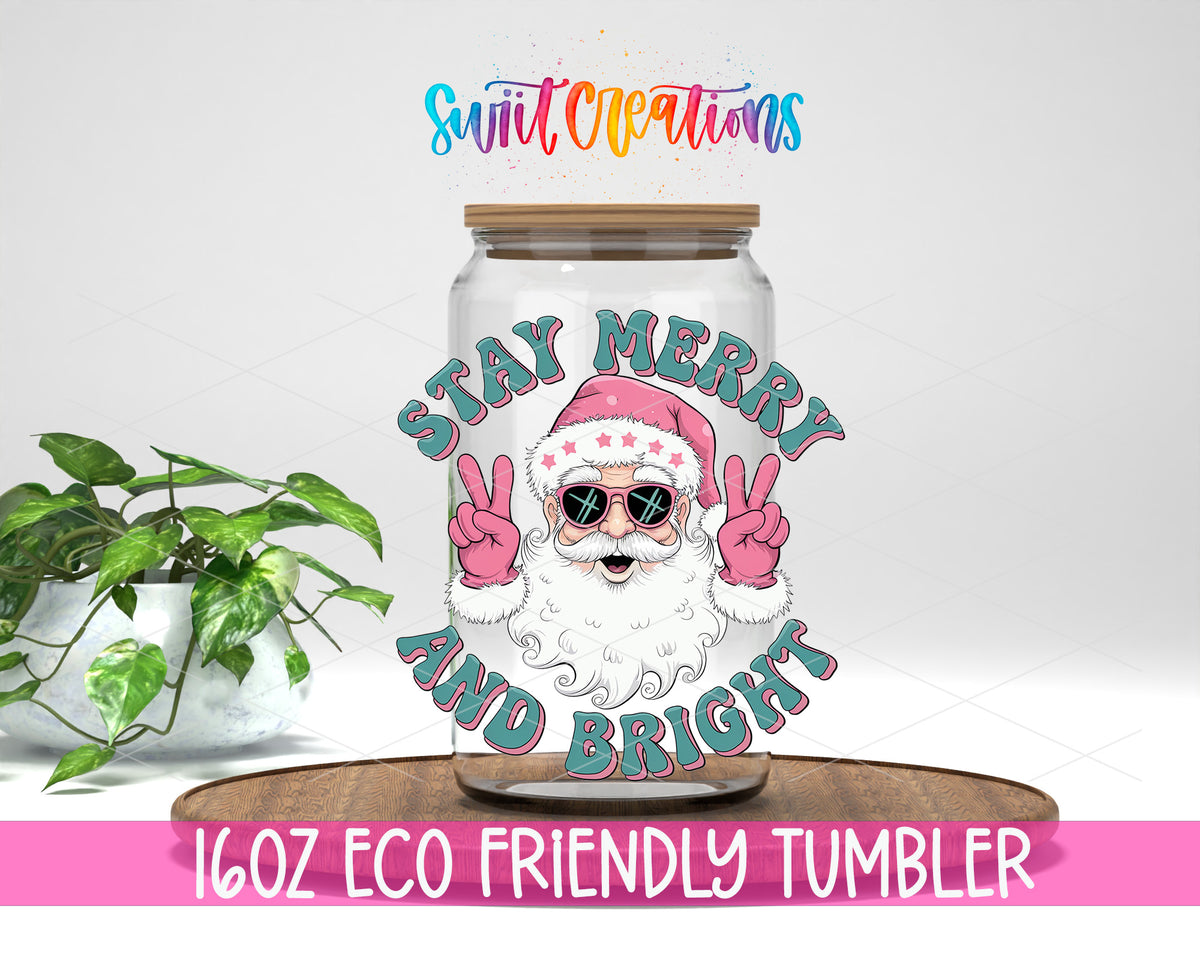 Stay Merry and Bright Santa design on a 16 oz clear glass tumbler with bamboo lid