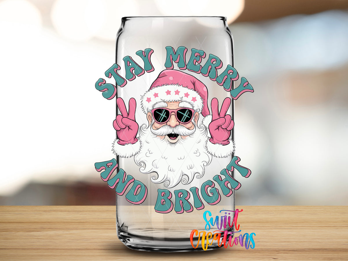 Stay Merry and Bright Santa design close-up on a clear glass can tumbler