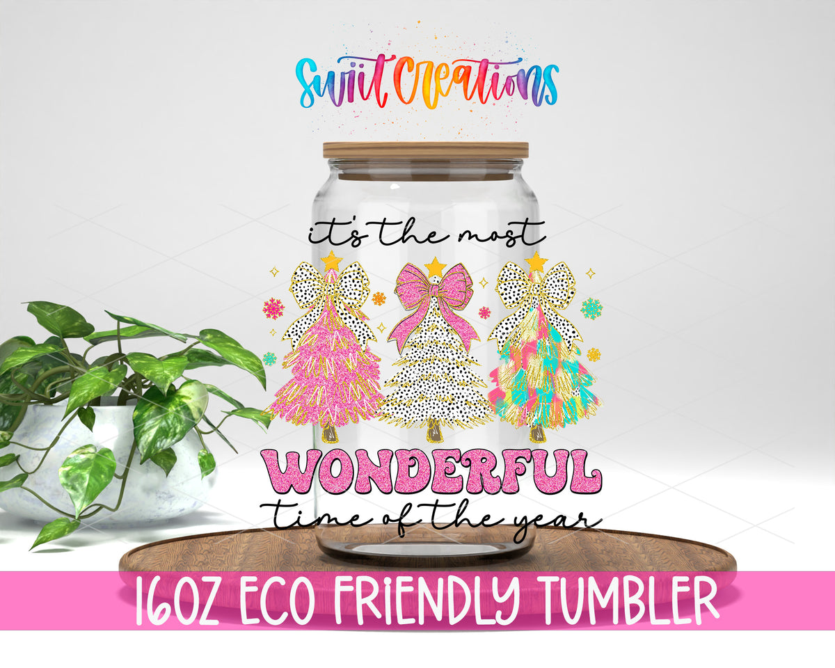 Most Wonderful Time Pink Christmas design on a 16 oz clear glass tumbler with bamboo lid