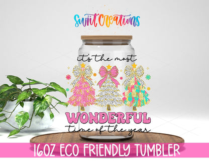 Most Wonderful Time Pink Christmas design on a 16 oz clear glass tumbler with bamboo lid