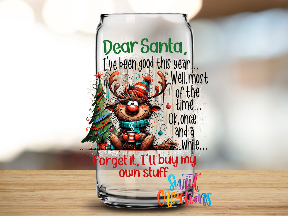 Dear Santa I'll Buy My Own Stuff design close-up on a clear glass can tumbler