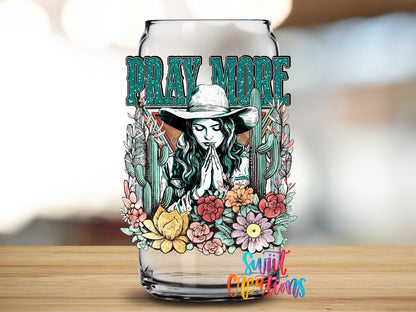Pray More design close-up on a clear glass can tumbler