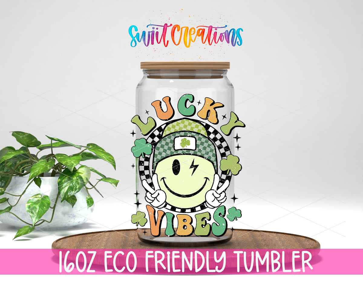 Lucky Vibes design on a 16 oz clear glass tumbler with bamboo lid