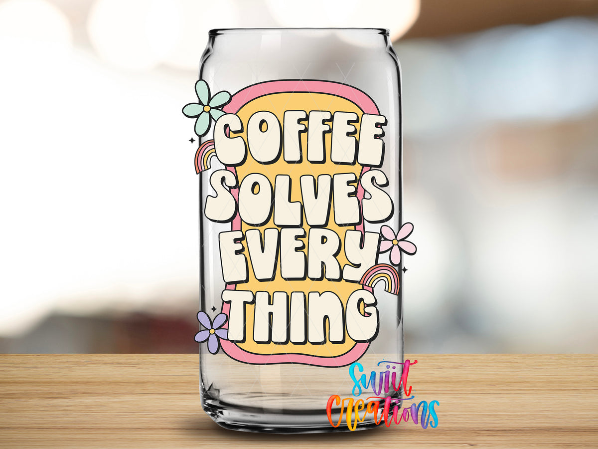 Coffee Solves Everything design close-up on a clear glass can tumbler