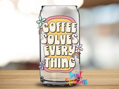Coffee Solves Everything design close-up on a clear glass can tumbler