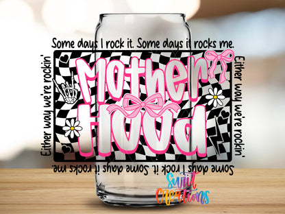 Motherhood design close-up on a clear glass can tumbler