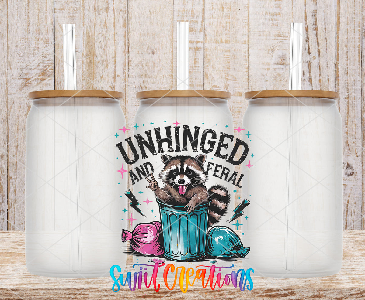Unhinged and Feral Raccoon frosted glass tumbler mockup with bamboo lids and straws