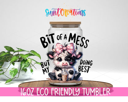 Bit of a Mess Cow design on a 16 oz clear glass tumbler with bamboo lid