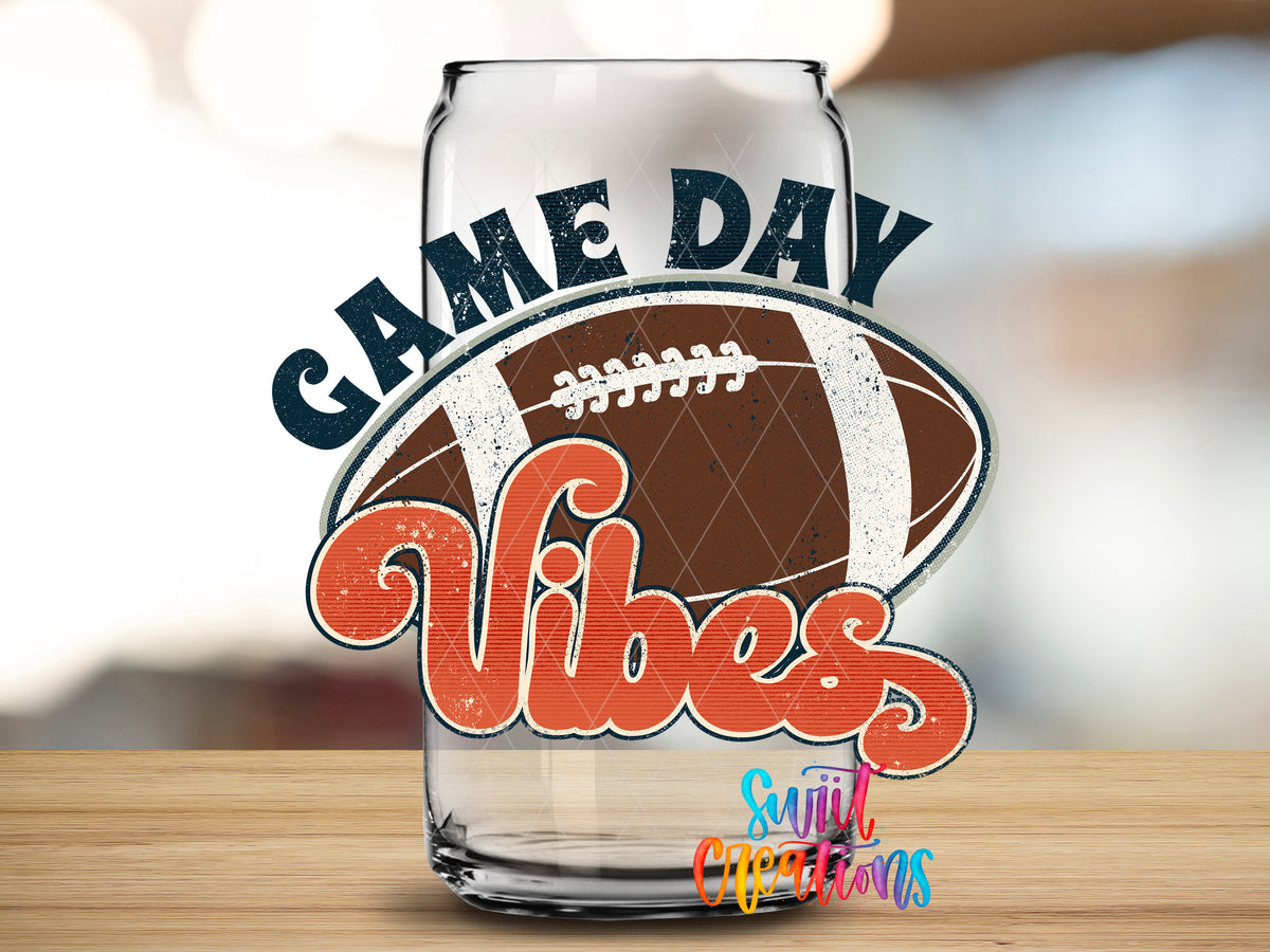Football Game Day Vibes design close-up on a clear glass can tumbler