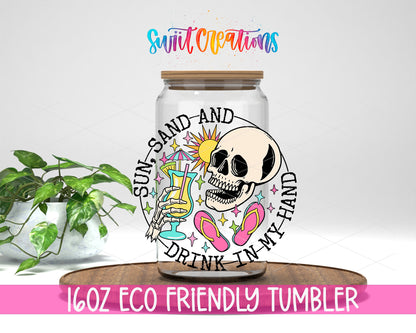 Sun Sand and Drink in My Hand design on a 16 oz clear glass tumbler with bamboo lid