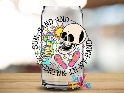 Sun Sand and Drink in My Hand design close-up on a clear glass can tumbler