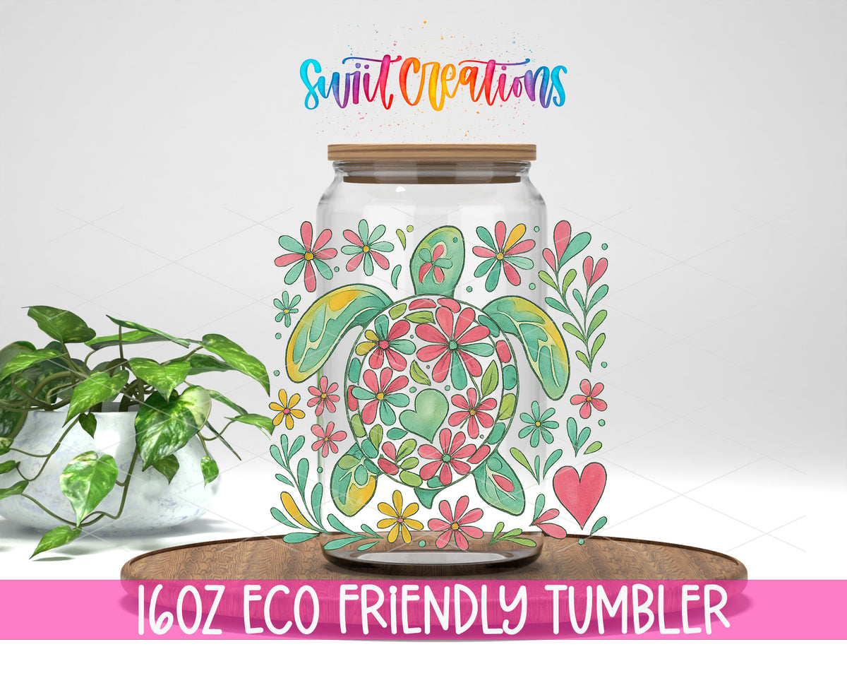 Floral Sea Turtle design on a 16 oz clear glass tumbler with bamboo lid