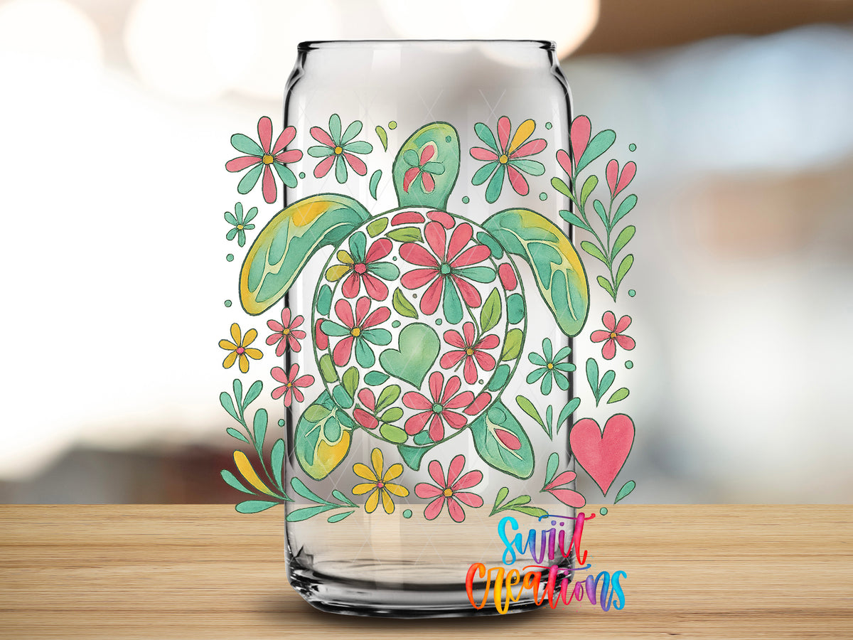 Floral Sea Turtle design close-up on a clear glass can tumbler