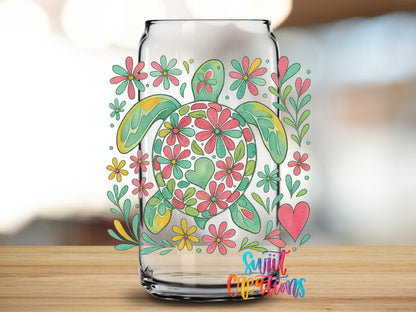 Floral Sea Turtle design close-up on a clear glass can tumbler