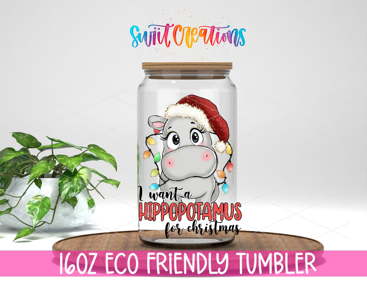 Hippopotamus for Christmas design on a 16 oz clear glass tumbler with bamboo lid