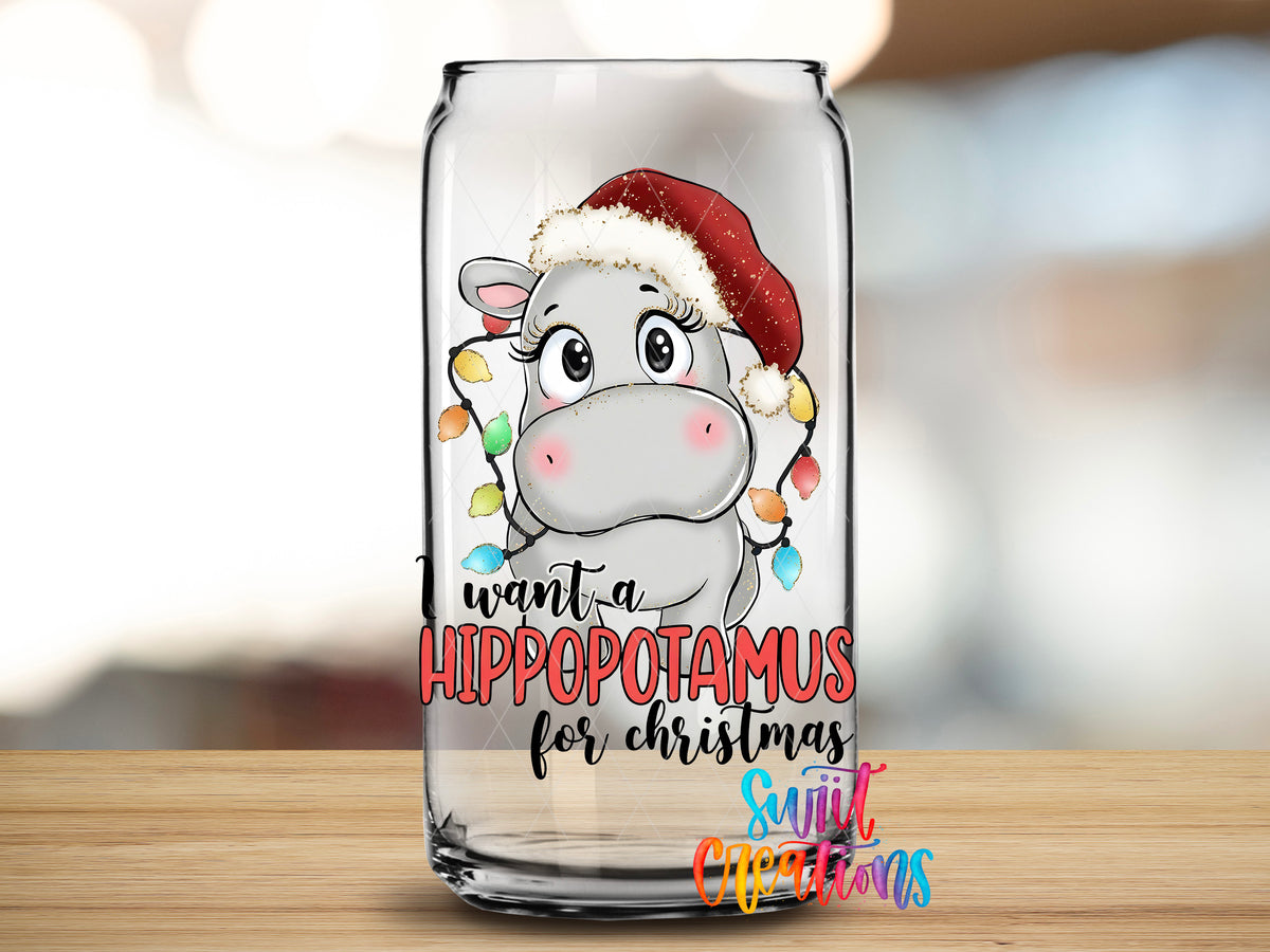 Hippopotamus for Christmas design close-up on a clear glass can tumbler