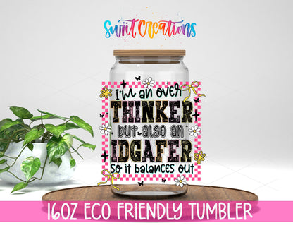 Overthinker and IDGAFer design on a 16 oz clear glass tumbler with bamboo lid