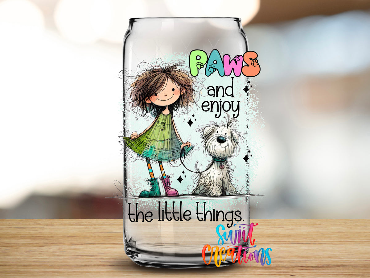 Paws and Enjoy design close-up on a clear glass can tumbler