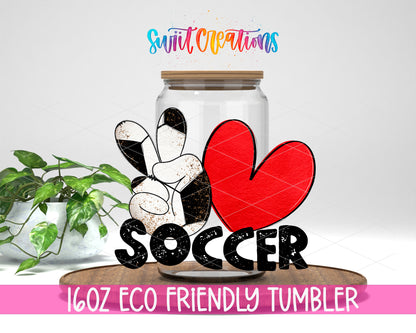 Peace Love Soccer design on a 16 oz clear glass tumbler with bamboo lid